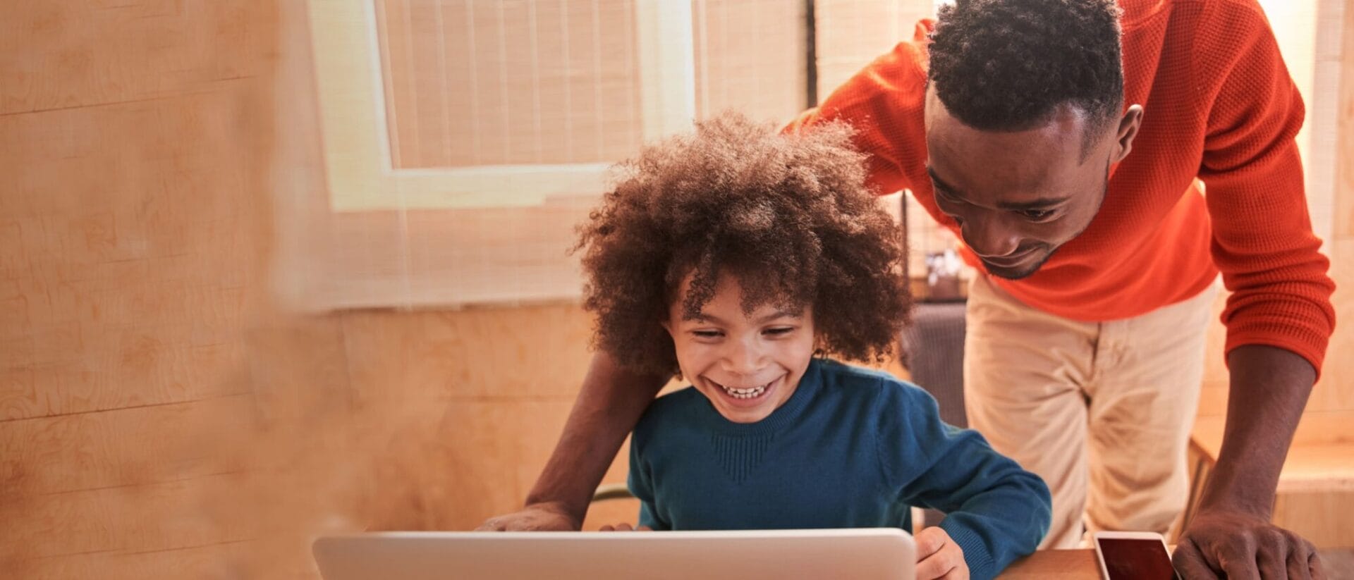 Father and son smiling